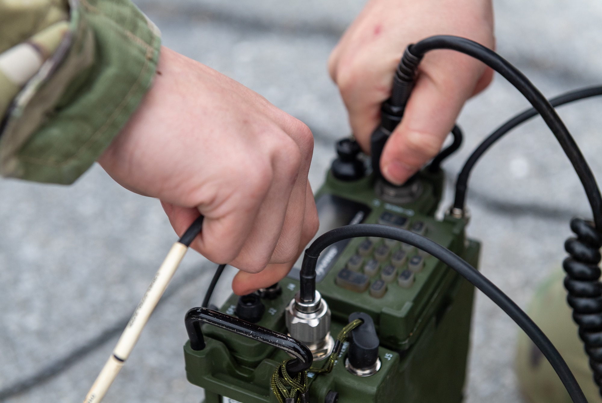 Radio frequency transmission systems specialists with the 271st Combat Communications Squadron assemble an AV2040 high-gain ultra high frequency satellite communications antenna connected to an AN/PRC-117G multiband networking radio which enables secure voice and data communications through a geostationary satellite for the warfighter, March 15, 2025.
