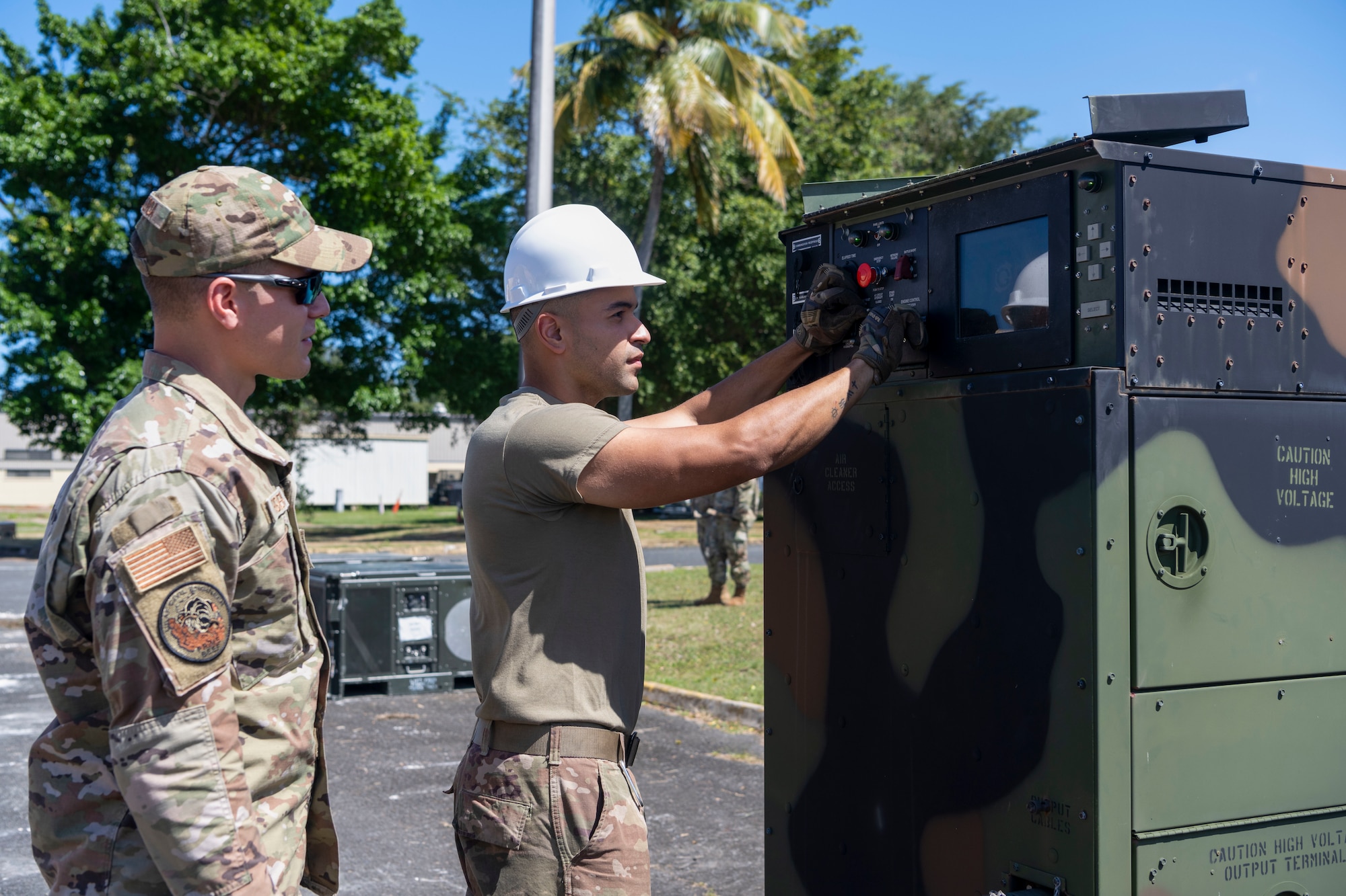 U.S. Air Force Staff Sgt. Luis Figueroa, a power production journeyman, and Staff Sgt. Frankie Rodriguez, a power production apprentice, both with the 156th Civil Engineer Squadron, Puerto Rico Air National Guard, operate a 60kw generator during a Disaster Relief Beddown System build up at Muñiz Air National Guard Base, Carolina, Puerto Rico, Feb. 27, 2025. The 156th CES Airmen assembled the DRBS, a system with the capacity to shelter 150 people in case of a disaster as a training opportunity in preparation for the March regularly scheduled drill. (U.S. Air National Guard photo by Master Sgt. Rafael D. Rosa)