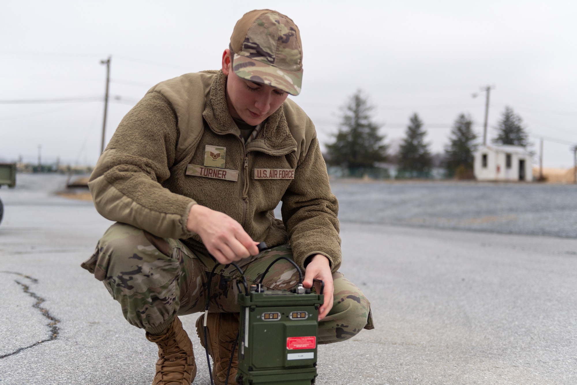Staff Sgt. Ethan Turner, radio frequency transmission systems specialist with the 271st Combat Communications Squadron, assembles an AV2040 high-gain ultra high frequency satellite communications antenna connected to an AN/PRC-117G multiband networking radio which enables secure voice and data communications through a geostationary satellite for the warfighter, March 15, 2025.