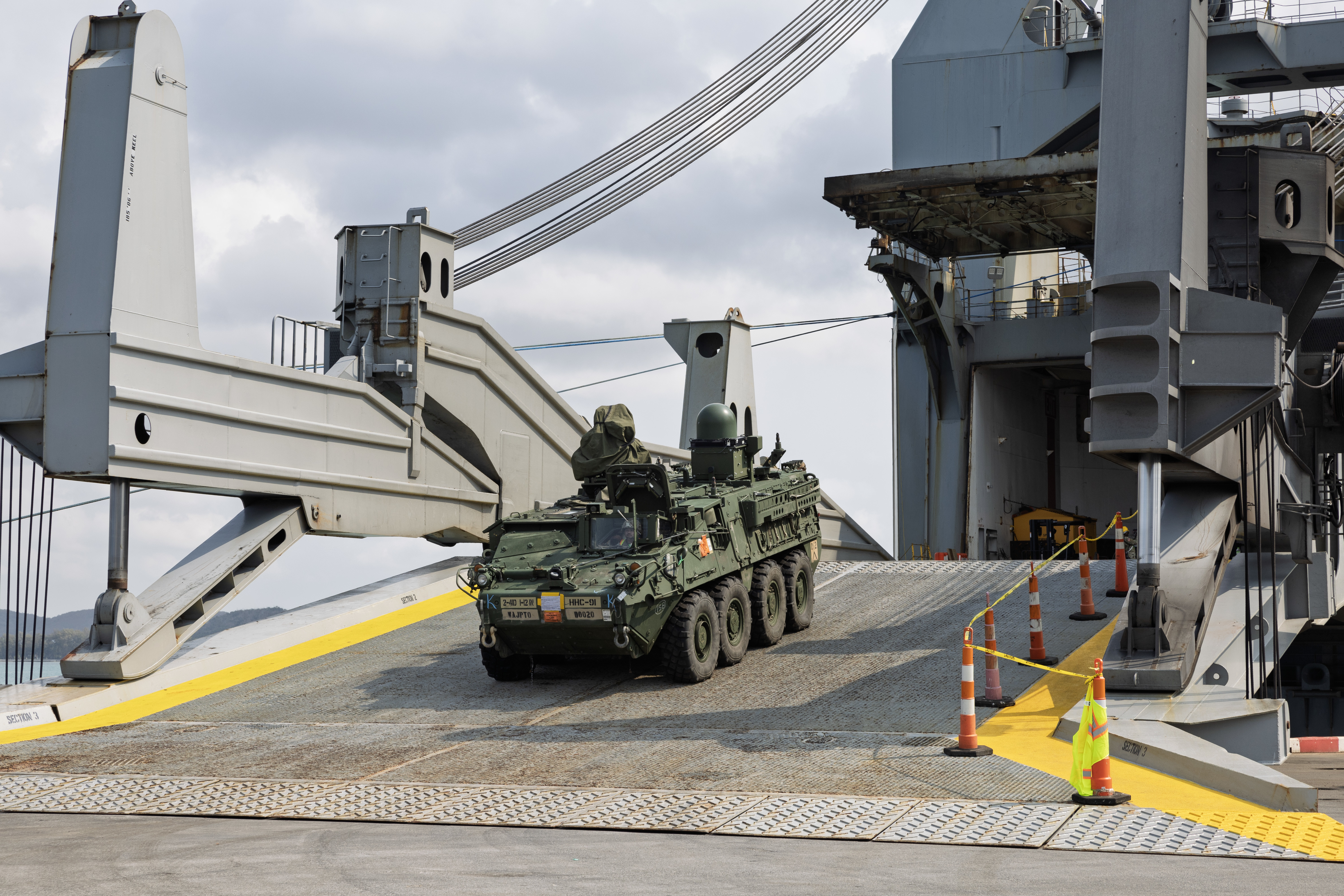 An M1126 Stryker is discharged from Military Sealift Command (MSC) chartered Motor Vessel Cape Henry (T-AKR 5067) at the pier in Sattahip, Thailand, Feb. 18, during an offload of equipment that will be used in Joint Exercise Cobra Gold 2025.
