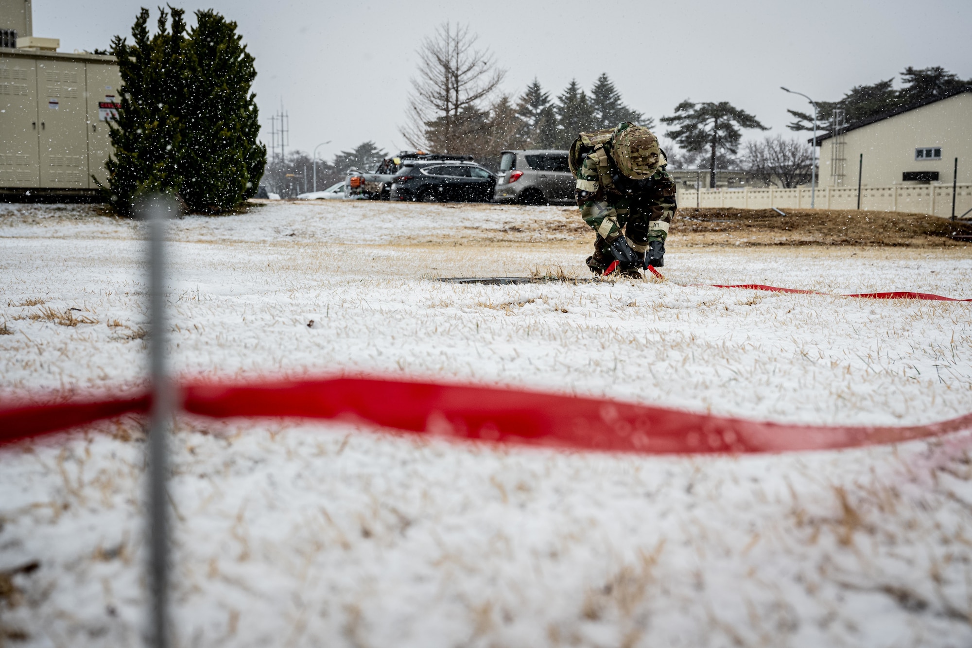 Airman cordons off an area