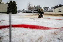 Airman cordons off an area