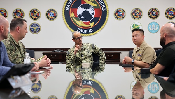 Cmdr. Vi Song Tring, chief medical informatics officer for Naval Medical Forces Pacific, introduces the Operational Medicine Health Informatics Advisory Group (OPMHAG) for Fleet, Navy Medicine, and Joint Operational Medicine Information Systems (JOMIS) program leaders who provided a presentation to Rear Adm. Guido Valdes, NMFP commander, and his staff about the Operational Medicine Care Delivery Platform (OpMed CDP), Feb. 27. The platform, a key element of the JOMIS program, aims to facilitate efficient and accurate documentation of care provided at Role 1 and Role 2 patient care, transforming Expeditionary Medicine (EXMED) capabilities and enhancing the effectiveness of medical forces. (Navy photo by Arsenio R. Cortez Jr.)