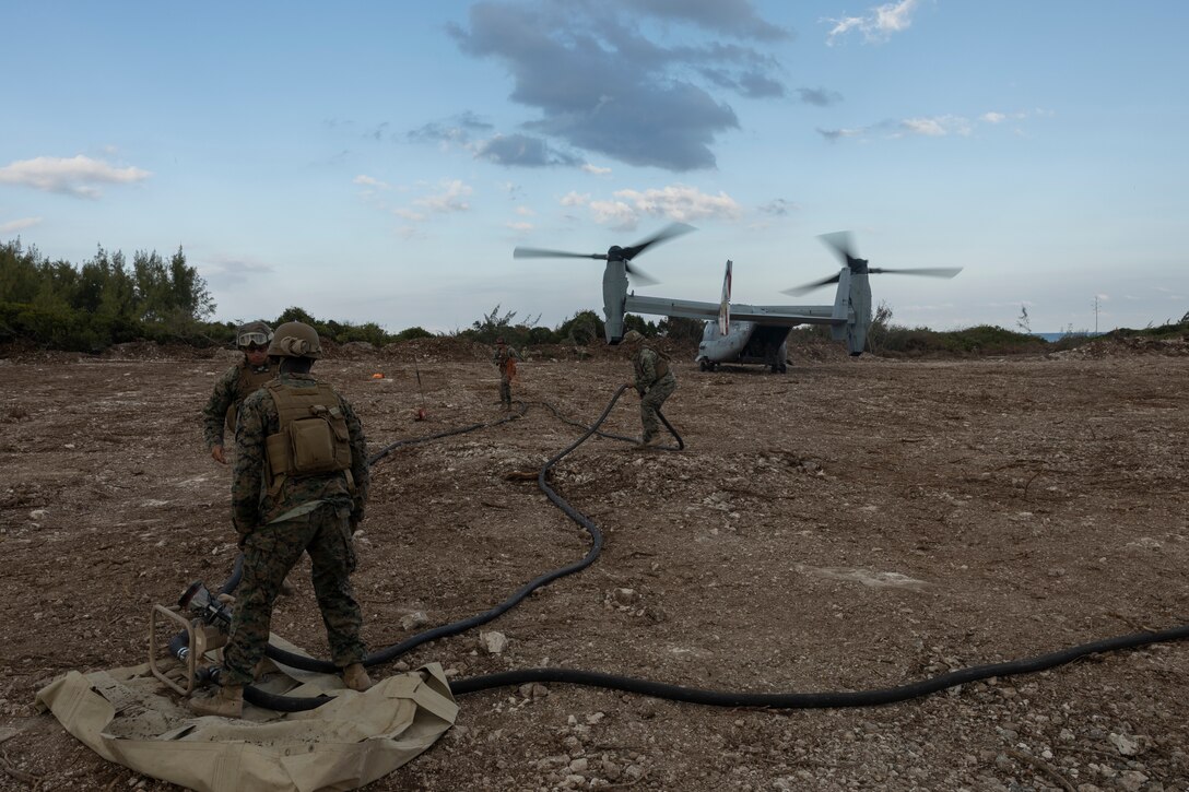 U.S Marines with Marine Wing Support Squadron (MWSS) 272 refuel an MV-22B Osprey assigned to Marine Medium Tiltrotor Squadron (VMM) 162 at an expeditionary landing zone near the U.S. Navy's Atlantic Undersea Test and Evaluation Center on Andros Island, Bahamas, Mar. 2, 2025. MWSS-272 deployed to the Bahamas to conduct aviation ground support rehearsals and refine distributed aviation operations for 2nd Marine Aircraft Wing. (U.S. Marine Corps photo by Lance Cpl. Mya Seymour)