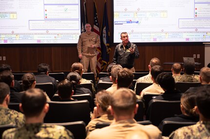 Rear Adm. Joseph Cahill, commander, Naval Surface Force Atlantic (COMNAVSURFLANT), give remarks to junior Surface Warfare Officers from various warships stationed at Naval Station Norfolk, Va., during the COMNAVSURFLANT 2025 Surface Junior Officer Summit (SJOS) at the Mariner Skills Training Center Atlantic on Naval Station Norfolk, March 13. SJOS is an annual event hosted by COMNAVSURFLANT, fostering discussion on a wide range of topics impacting the surface warfare community. (U.S. Navy photo by Keith A. Goodsell)