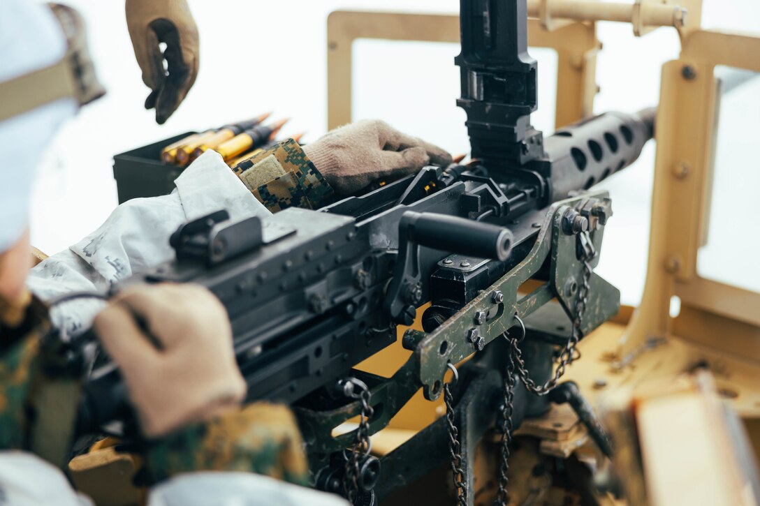 A U.S. Marine with Combat Logistics Battalion 2, Combat Logistics Regiment 2, 2nd Marine Logistics Group loads an M2A1 machine gun during a crew-served weapons range in preparation of Exercise Joint Viking 25 in Setermoen, Norway, Feb. 25, 2025. U.S. Marines are in Norway as part of exercise Joint Viking 25, a Norwegian military exercise focusing on arctic cold-weather training and military-to-military engagements. The exercise demonstrates the Marine Corps' unique ability to rapidly deploy during a crisis and aims to enhance interoperability between the U.S. Marine Corps and NATO allies and partners. (U.S. Marine Corps photo by Cpl. Alfonso Livrieri)