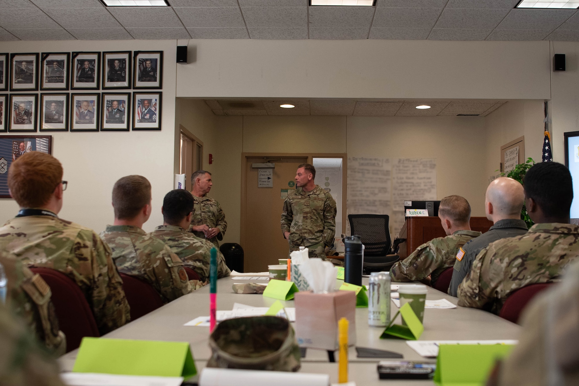 U.S. Air Force Col. Jeff McMaster, 27th Special Operations Wing deputy commander, and U.S. Air Force Chief Master Sgt. Mark Marberg, 27th Special Operations Mission Support Group senior enlisted leader, speak to a class of company grade officers in the First Term Officers Course at Cannon Air Force Base, New Mexico, March 12, 2025. The mission of the 27th SOW requires critical decisions to be made at the lowest level, and FTOC is designed to help CGOs be successful decision-makers. (U.S. Air Force photo by Tech. Sgt. Jacob Albers)