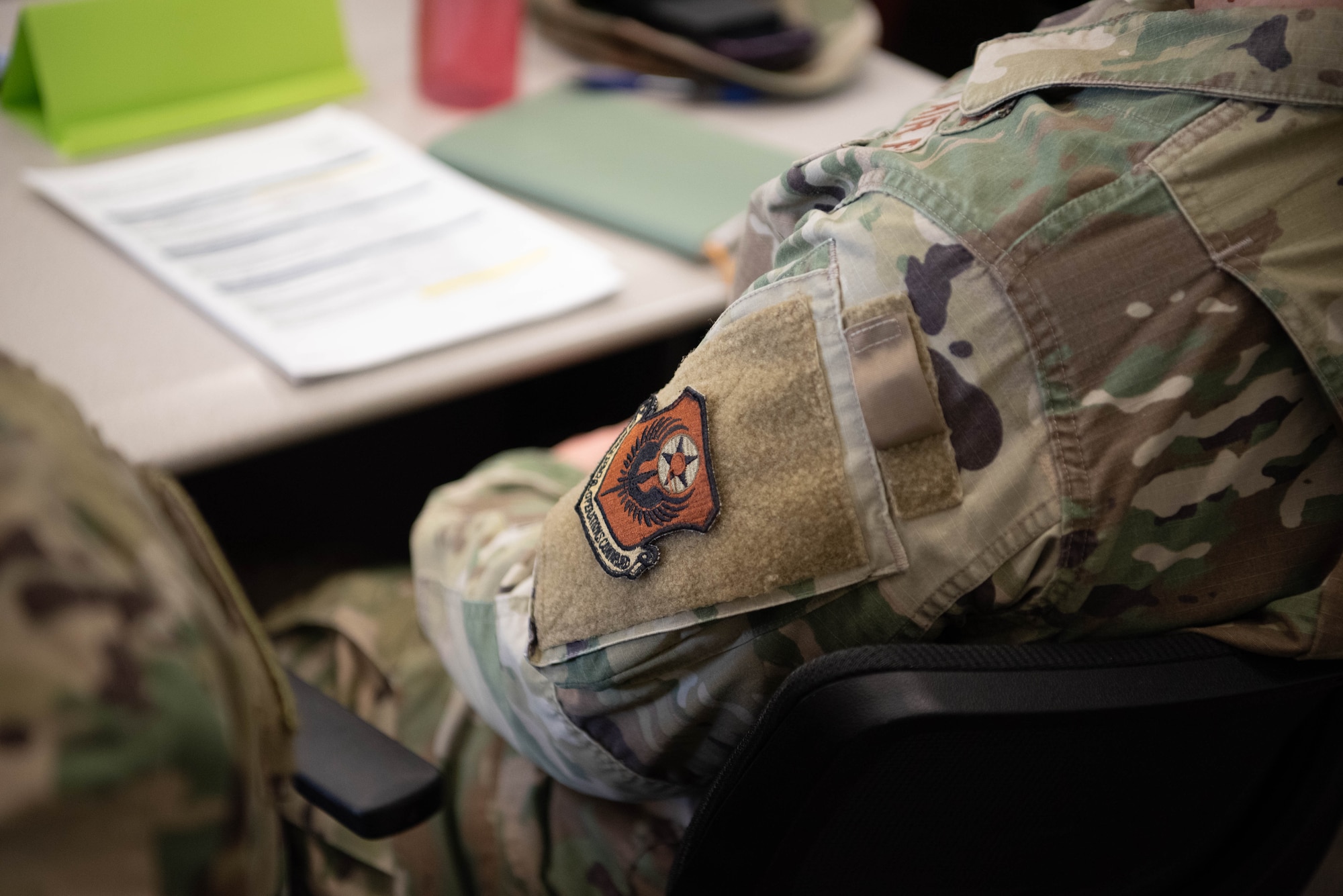 A student sits in a briefing during the First Term Officers Course at Cannon Air Force Base, March 12, 2025. The 27th Special Operations Wing introduced FTOC as an integral piece of the Air Force Special Operations Command mission to Raise Air Commandos. (U.S. Air Force photo by Tech. Sgt. Jacob Albers)