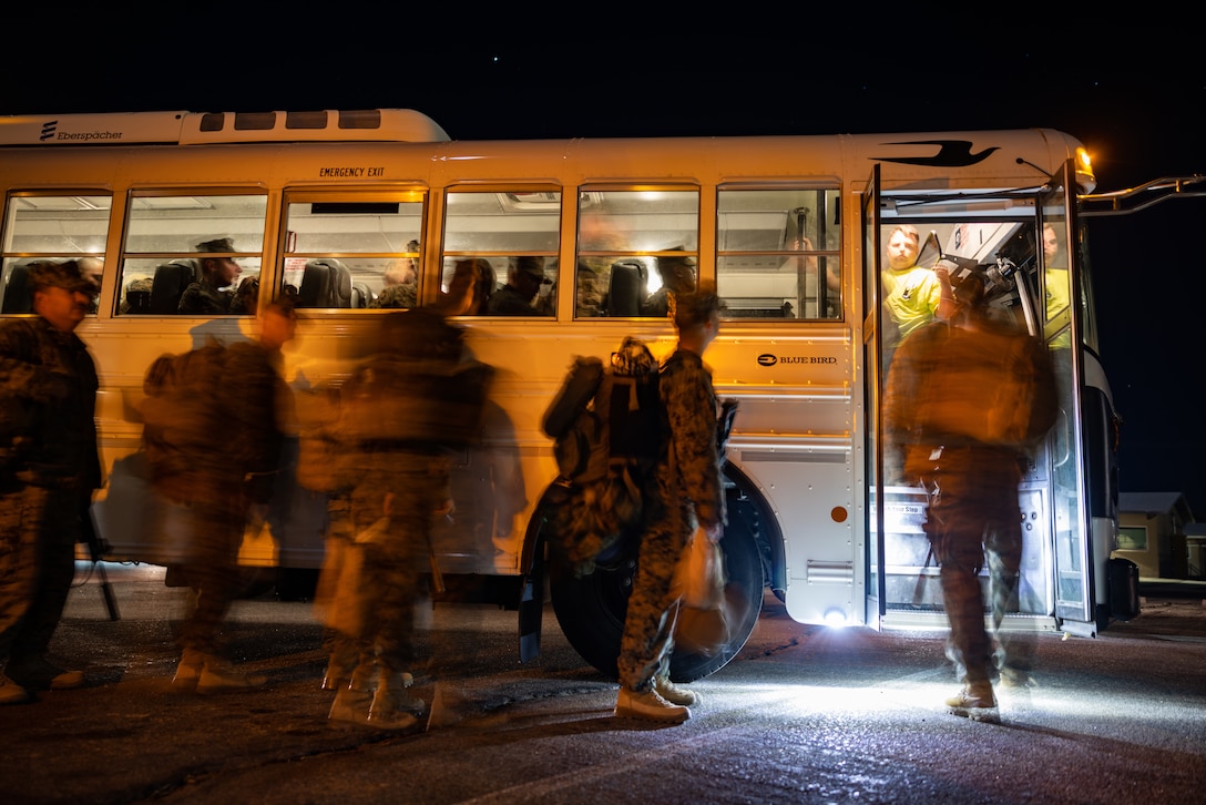 U.S. Marines with 2nd Battalion, 23rd Marines, 4th Marine Division, Marine Forces Reserve, walk into a bus on Marine Air Ground Combat Center Twentynine Palms, California, March 11, 2025.The Marines are headed to Kadena Air Base, Okinawa, Japan as part of Unit Deployment Program 25.1. The activation marks the beginning of an intensive period of training for 2nd Battalion, 23rd Marines as they provide a total force solution in support of the UDP by aligning Marine Forces Reserve’s commitment to Marine Corps strategic objectives. This is first time since 2020 that an entire Reserve infantry battalion has activated to support the Unit Deployment Program. (U.S. Marine Corps photo by Sgt. Scott Jenkins)