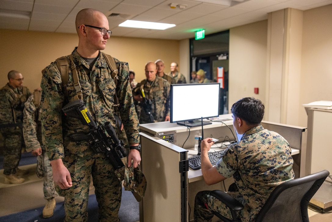 U.S. Marine Corps Cpl. Zachary Fisher, a Mortarman, with Company G, 2nd Battalion, 23rd Marines, 4th Marine Division, Marine Forces Reserve, and a native of Oxnard California, stands on a scale to be flight manifested at March Air Reserve Base, California, March 12, 2025.The Marines are headed to Kadena Air Base, Okinawa, Japan as part of Unit Deployment Program 25.1. The activation marks the beginning of an intensive period of training for 2nd Battalion, 23rd Marines as they provide a total force solution in support of the UDP by aligning Marine Forces Reserve’s commitment to Marine Corps strategic objectives. This is first time since 2020 that an entire Reserve infantry battalion has activated to support the Unit Deployment Program. (U.S. Marine Corps photo by Sgt. Scott Jenkins)
