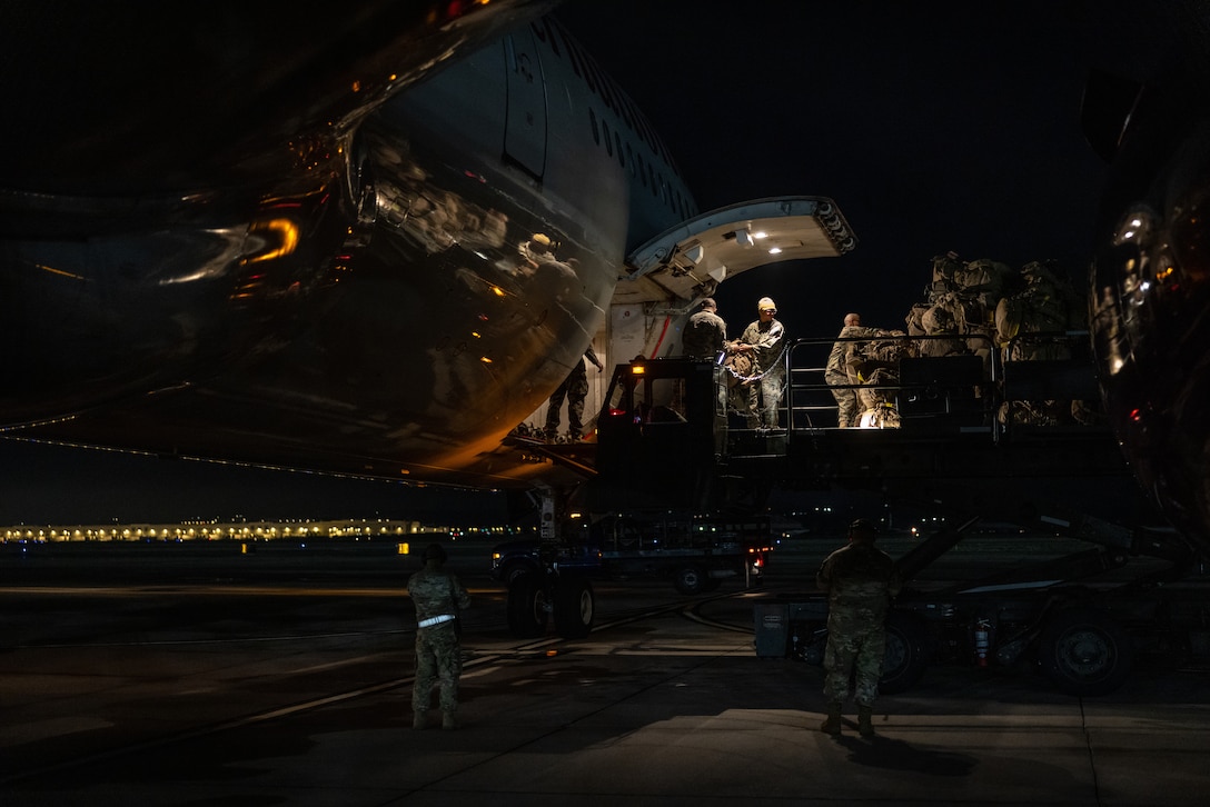 U.S. Marines with 2nd Battalion, 23rd Marines, 4th Marine Division, Marine Forces Reserve, load packs into a Boeing 747 airplane at March Air Reserve Base, California, March 12, 2025. The Marines are headed to Kadena Air Base, Okinawa, Japan as part of Unit Deployment Program 25.1. The activation marks the beginning of an intensive period of training for 2nd Battalion, 23rd Marines as they provide a total force solution in support of the UDP by aligning Marine Forces Reserve’s commitment to Marine Corps strategic objectives. This is first time since 2020 that an entire Reserve infantry battalion has activated to support the Unit Deployment Program. (U.S. Marine Corps photo by Sgt. Scott Jenkins)