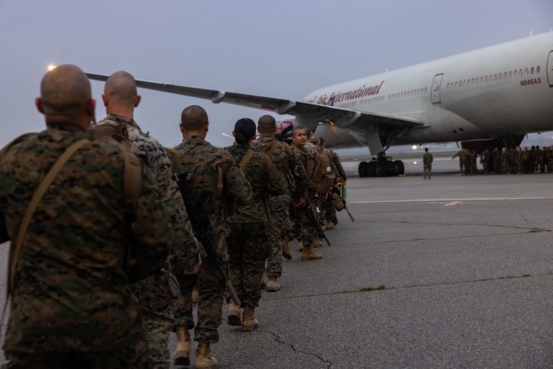 U.S. Marines with 2nd Battalion, 23rd Marines, 4th Marine Division, Marine Forces Reserve, walk onto a Boeing 747 airplane at March Air Reserve Base, California, March 12, 2025. The Marines are headed to Kadena Air Base, Okinawa, Japan as part of Unit Deployment Program 25.1. The activation marks the beginning of an intensive period of training for 2nd Battalion, 23rd Marines as they provide a total force solution in support of the UDP by aligning Marine Forces Reserve’s commitment to Marine Corps strategic objectives. This is first time since 2020 that an entire Reserve infantry battalion has activated to support the Unit Deployment Program. (U.S. Marine Corps photo by Sgt. Scott Jenkins)