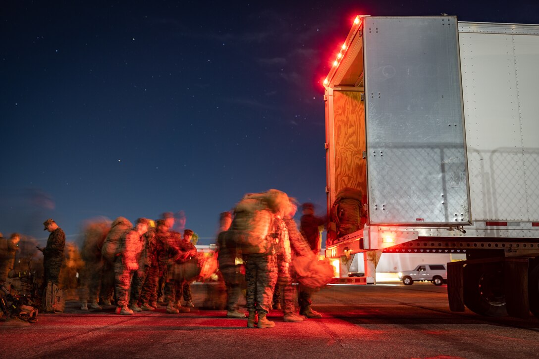 U.S. Marines with 2nd Battalion, 23rd Marines, 4th Marine Division, Marine Forces Reserve, pass packs down a line into a box truck on Marine Air Ground Combat Center Twentynine Palms, California, March 11, 2025.The Marines are headed to Kadena Air Base, Okinawa, Japan as part of Unit Deployment Program 25.1. The activation marks the beginning of an intensive period of training for 2nd Battalion, 23rd Marines as they provide a total force solution in support of the UDP by aligning Marine Forces Reserve’s commitment to Marine Corps strategic objectives. This is first time since 2020 that an entire Reserve infantry battalion has activated to support the Unit Deployment Program. (U.S. Marine Corps photo by Sgt. Scott Jenkins)