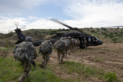 Soldiers assigned to the 34th Infantry Division, load a 3rd Combat Aviation Brigade, supporting the 4th Infantry Division, UH-60 Blackhawk during aerial gunnery training as part of Immediate Response 23 in North Macedonia, May 27, 2023. Immediate Response 23 takes place in Albania, Bulgaria, Croatia, Kosovo, Montenegro, North Macedonia and Slovenia, and includes approximately 2,800 U.S. and 7,000 multinational participants. The operational readiness of U.S. forces across all domains is critical to building partnerships, responding to crisis, providing deterrence and supporting our Allies and Partners. (U.S. Army photo by Sgt. Caitlin Wilkins, 3rd Combat Aviation Brigade)