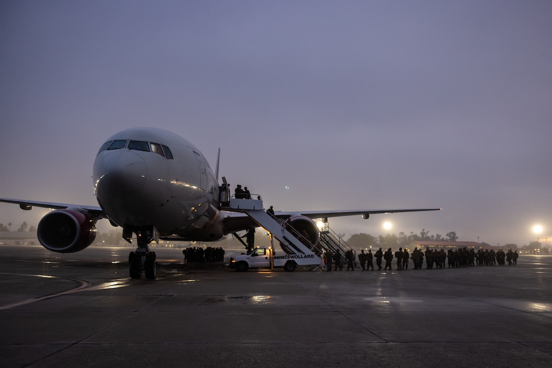 U.S. Marines with 2nd Battalion, 23rd Marines, 4th Marine Division, Marine Forces Reserve, walk onto a Boeing 747 airplane at March Air Reserve Base, California, March 12, 2025. The Marines are headed to Kadena Air Base, Okinawa, Japan as part of Unit Deployment Program 25.1. The activation marks the beginning of an intensive period of training for 2nd Battalion, 23rd Marines as they provide a total force solution in support of the UDP by aligning Marine Forces Reserve’s commitment to Marine Corps strategic objectives. This is first time since 2020 that an entire Reserve infantry battalion has activated to support the Unit Deployment Program. (U.S. Marine Corps photo by Sgt. Scott Jenkins)