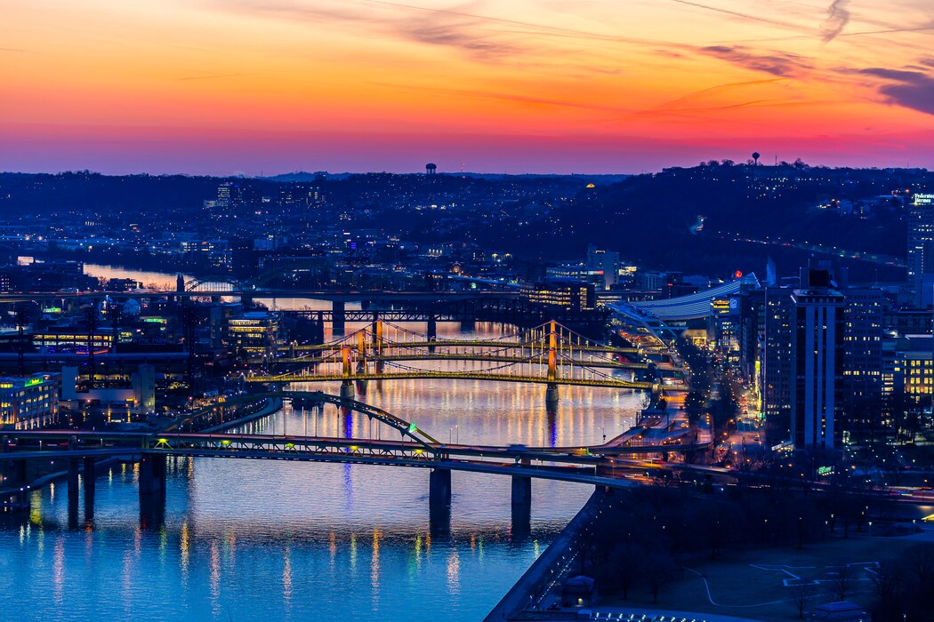 The sun rises over the Pittsburgh skyline March 13, 2025.