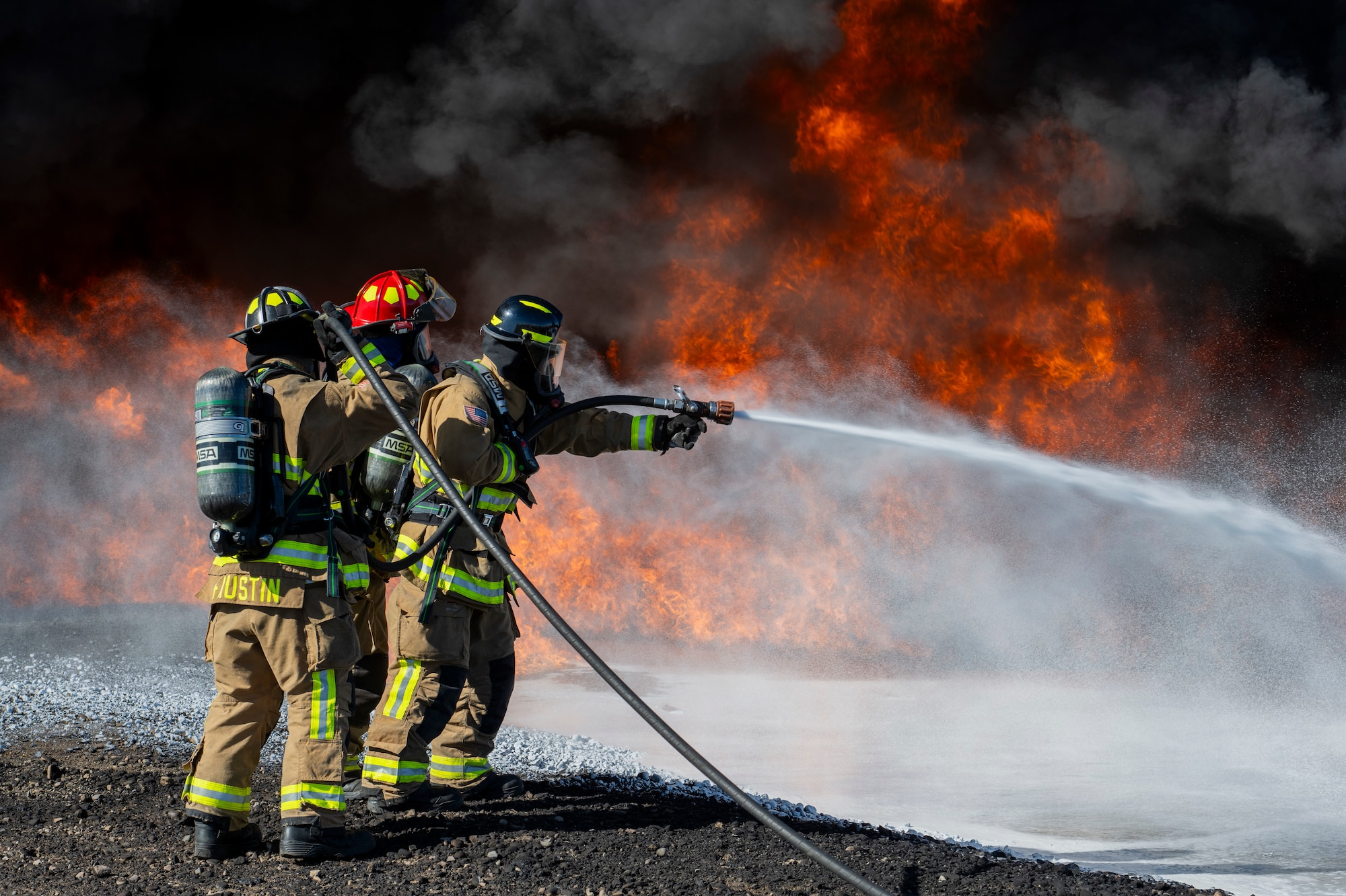 Hill and Mountain Home Air Force Base firefighters joined for training exercise where they tested equipment configured for new firefighting foam Fluorine-Free Foam on a JP-8 fuel burning fire.