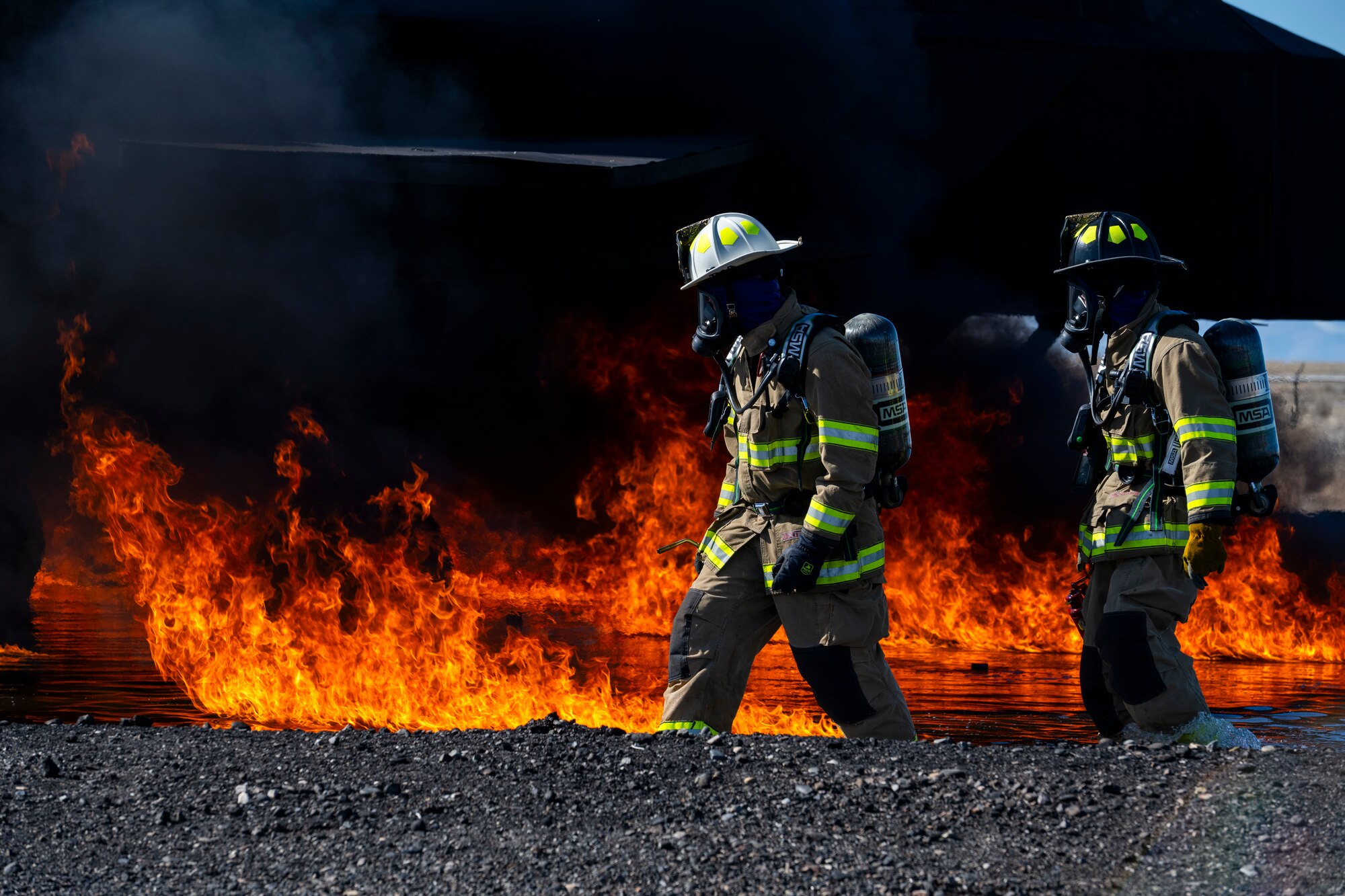 Hill and Mountain Home Air Force Base firefighters joined for training exercise where they tested equipment configured for new firefighting foam Fluorine-Free Foam on a JP-8 fuel burning fire.