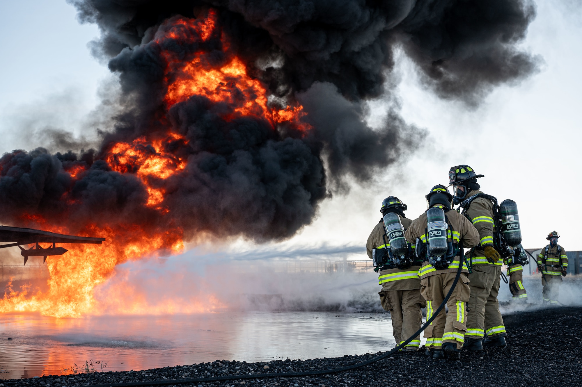 Hill and Mountain Home Air Force Base firefighters joined for training exercise where they tested equipment configured for new firefighting foam Fluorine-Free Foam on a JP-8 fuel burning fire.