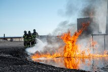 Hill and Mountain Home Air Force Base firefighters joined for training exercise where they tested equipment configured for new firefighting foam Fluorine-Free Foam on a JP-8 fuel burning fire.