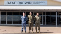 U.S. Marine Corps Col. Jason C. Armas, center, the commanding officer of Marine Rotational Force – Darwin 25.3, and Sgt. Maj. Michael T. Escobar, right, the sergeant major of MRF – D 25.3, pose for a photo with Group Captain Melissa Neilson, the commander of Northern Command, at Royal Australian Air Force Base Darwin, Northern Territory, Australia, March 17, 2025.