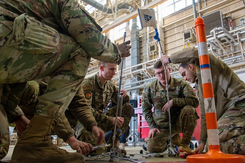 Airmen assigned to the 730th Air Mobility Squadron compete in a Tower of Tools competition.