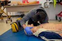 250303-N-KC192-1140 SPRING LAKE, N.C. (Mar. 3, 2025) - Hospital Corpsman 1st Class Axel Narvaez, the regional training officer assigned to Naval Medical Forces Atlantic (NMFL),  checks the airway breathing of a simulated patient during a training scenario during a paramedic training scenario at Fayetteville Technical Community College, Mar. 3, 2025. The primary purpose of the 20-week joint military paramedic course at Fayetteville Technical Community College in Spring Lake, North Carolina is to expand the skills of service members, and increase survivability of those in harm’s way. Navy Medicine is enhancing Expeditionary Medical Unit (EXMED) capabilities by equipping Hospital Corpsmen with advanced trauma and pre-hospital care skills through an accelerated paramedic training program. This intensive five-month course ensures corpsmen are prepared to deliver life-sustaining care in austere environments, strengthening the Navy’s ability to support warfighters in operational settings worldwide. (U.S. Navy photo by Mass Communication Specialist 2nd Class Levi Decker)