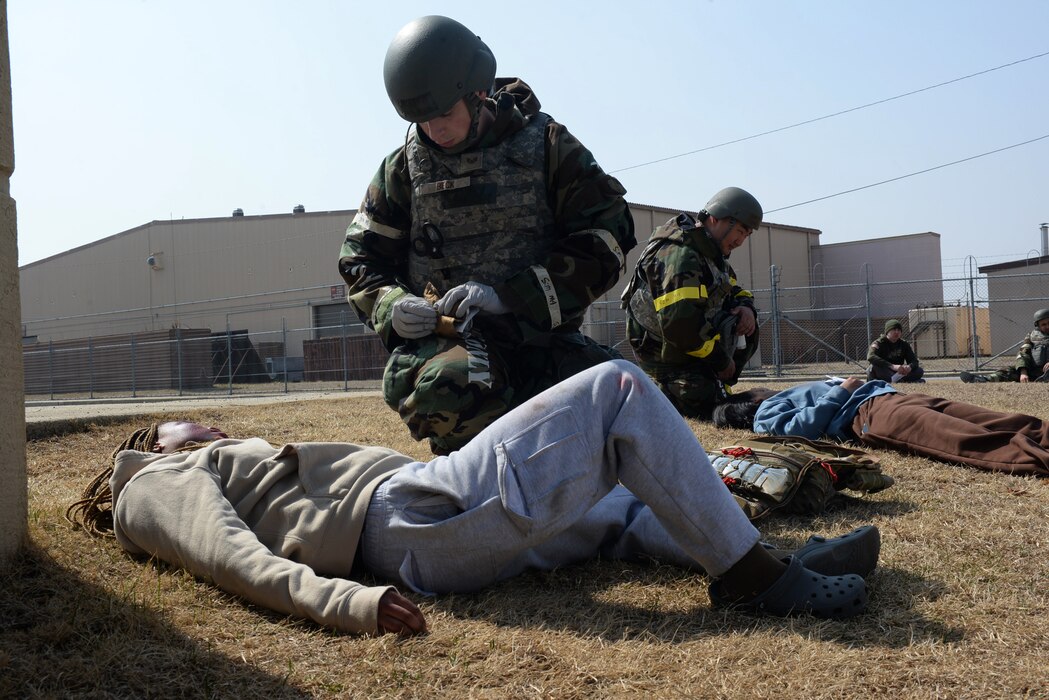 U.S. Air Force Airmen assigned to the 51st Fighter Wing provide tactical combat casualty care to simulated casualties during Freedom Shield 25 at Osan Air Base, Republic of Korea, Mar. 11, 2025. The life-saving TCCC procedures can be rendered by any service member, to onesself or one another, when injuries are sustained in a combat environment. During Freedom Shield 25, units across Seventh Air Force validated several agile combat employment capabilities, illustrating the air component’s ability to maneuver forces and supplies rapidly, projecting and sustaining airpower from numerous locations across the region. (U.S. Air Force photo by Master Sgt. Jerilyn Quintanilla)
