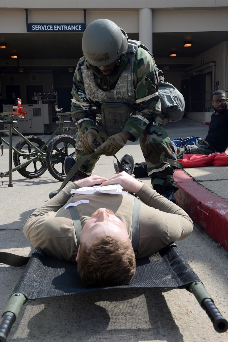 A U.S. Air Force Airman assigned to the 51st Fighter Wing, applies a tourniquet to a simulated casualty during Freedom Shield 25 at Osan Air Base, Republic of Korea, Mar. 11, 2025. Tactical combat casualty care is a prehospital, acute-care response procedure that service members can use to render life-saving capabilities in contingency operation environments. During FS25, personnel across Seventh Air Force participated in large-scale, realistic training to strengthen interoperability, reinforce the ROK-U.S. combined defense posture, and increase combat readiness. (U.S. Air Force photo by Master Sgt. Jerilyn Quintanilla)