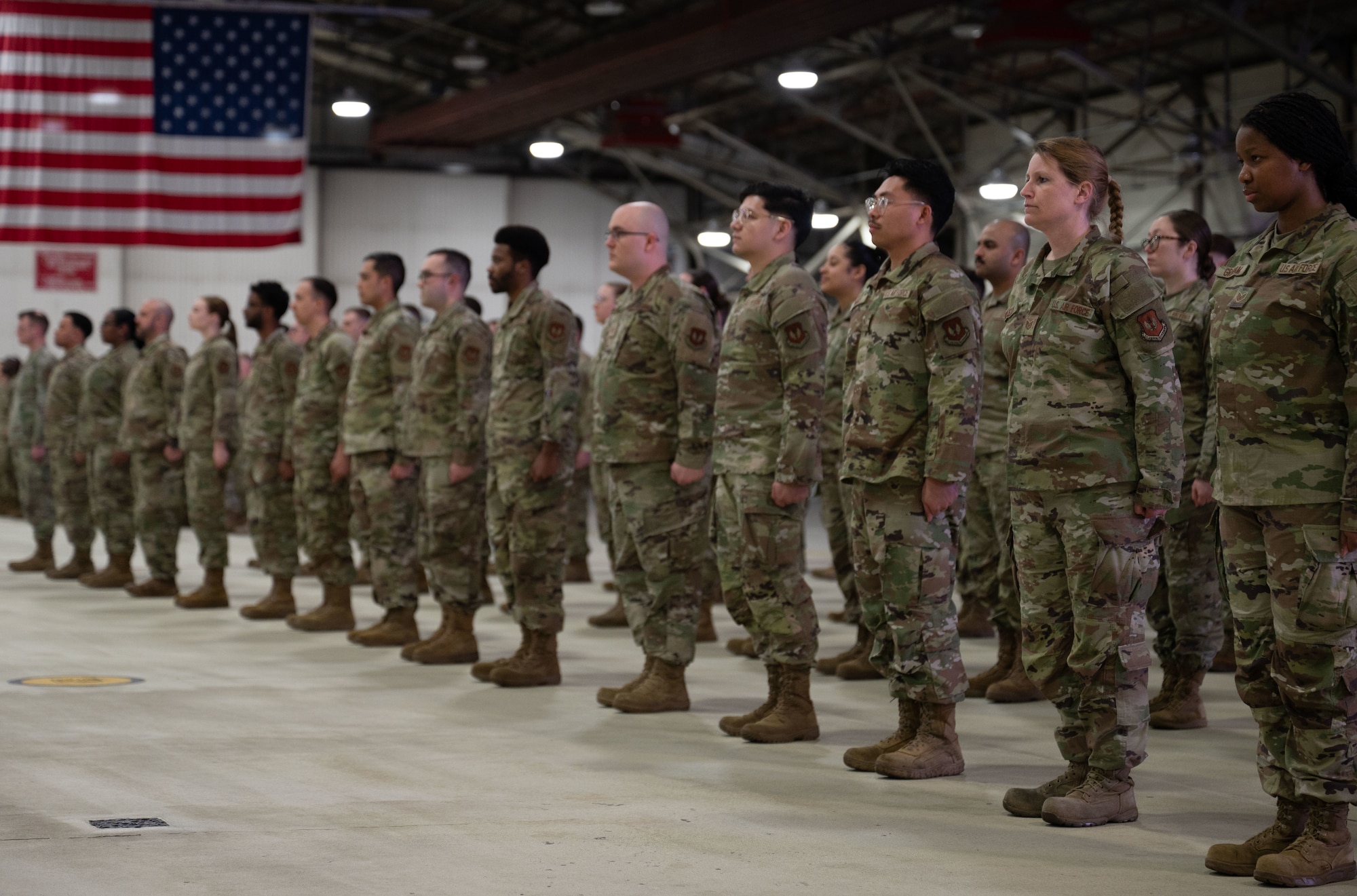 Airmen stand side by side.