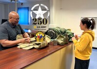 Adreaell Ray (left) is the Logistics Readiness Center Stuttgart Central Issue Facility chief. Ray, who retired in 2021 after 24 years of active-duty service, has been working at the CIF as an Army Civilian since December. He said, “I feel blessed to be a part of this commemorative moment in the U.S. Army’s long and distinguished history. 250 years! Happy birthday, U.S. Army!” (U.S. Army courtesy photo)