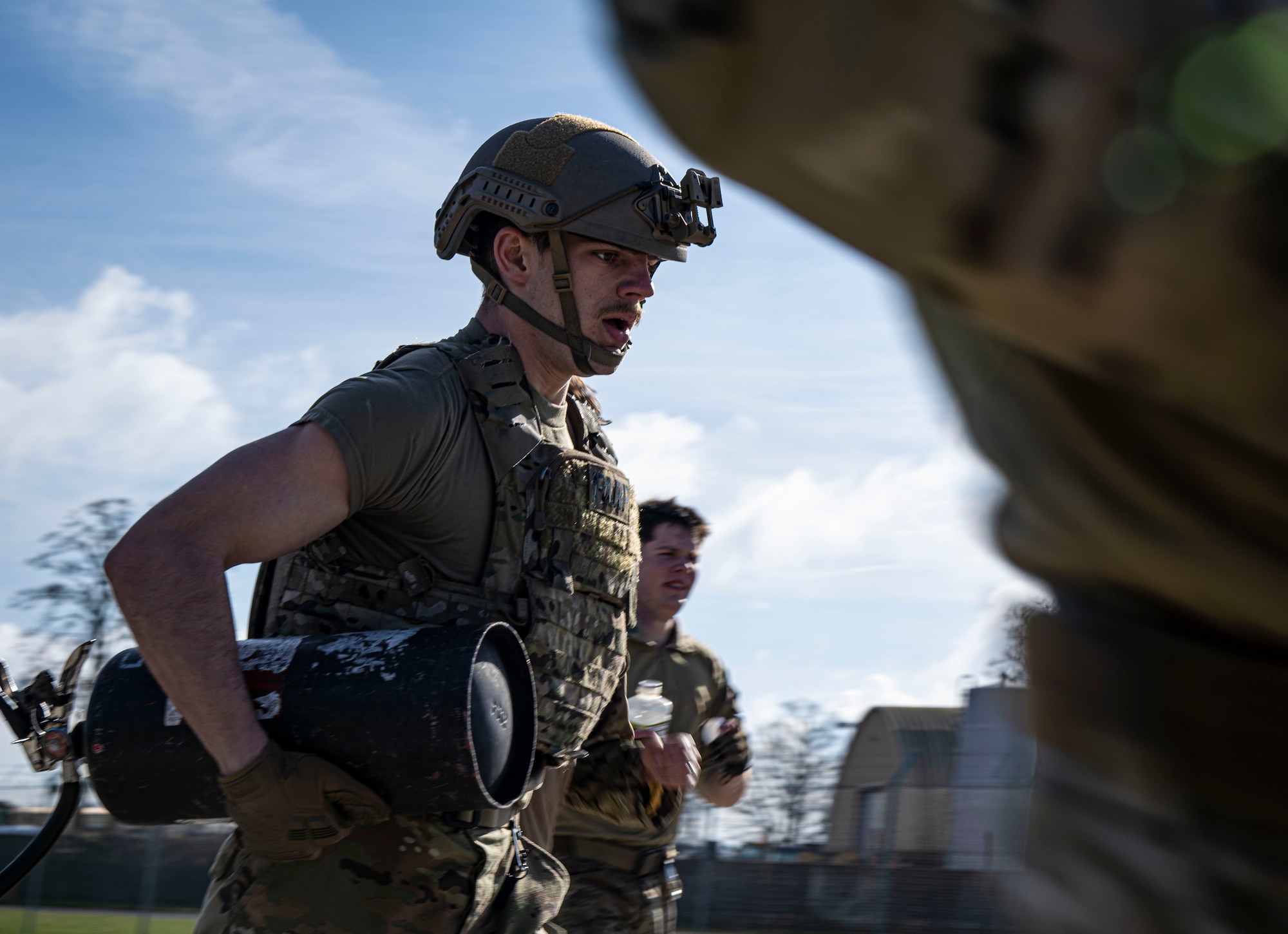 U.S. Air Force Airman 1st Class William Hall, 100th Logistics Readiness Squadron fuels distribution apprentice, runs with equipment during a forward area refueling point team tryout at RAF Mildenhall, England, March 14, 2025.