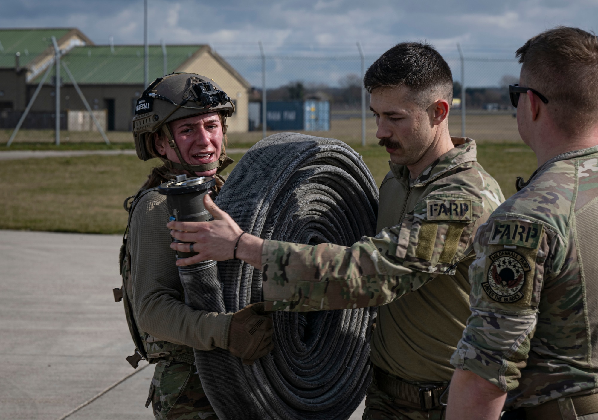 U.S. Air Force 2nd Lt. Claire Stewart, 100th Logistics Readiness Squadron traffic management office officer in charge, carries a fuel hose during her forward area refueling point team tryout at RAF Mildenhall, England, March 14, 2025.