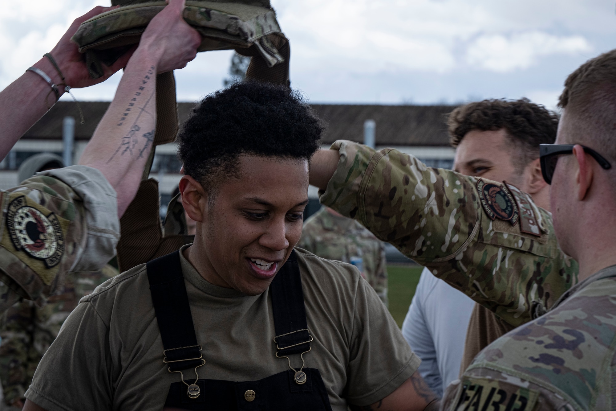 U.S. Air Force Staff Sgt. Rasean Chong, 100th Logistics Readiness Squadron refueler and fire truck maintenance non commissioned officer in charge, removes his vest after completing his forward area refueling point team tryout at RAF Mildenhall, England, March 14, 2025.