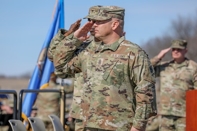 Command Sgt. Maj. Christopher Solis, the incoming command sergeant major for 90th Troop Command, salutes the flag during the playing of the national anthem during a change of responsibility ceremony at Camp Gruber Training Center Saturday, March 1, 2025. The ceremony signifies the transfer of responsibility from outgoing command sergeant major, Command Sgt. Maj. Railyn Sanderson to Solis. 

“I'm a troop Soldier, so I like to be out there,” said Solis. “I like to see what everybody is doing. So just be prepared. I'm looking forward to seeing what you do.” 

(Oklahoma National Guard photo by Staff Sgt. Bradley Cooney)