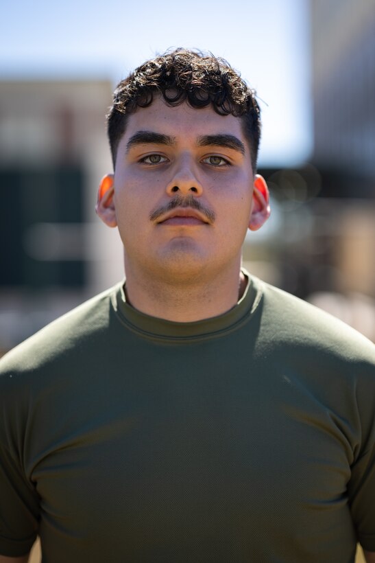 U.S. Marine Corps Cpl. Aaron TorresLemus, combat videographer, Headquarters Battalion, Marine Forces Reserve, stands for a portrait before getting pepper sprayed during Security Augmentation Force training, Marine Corps Support Facility, New Orleans, Feb. 26, 2025. Marines experience the effects of pepper spray to learn when to use it appropriately as a method of de-escalation, and to understand how to defend themselves or apprehend suspects. (U.S. Marine Corps photo by Sgt. Scott Jenkins)