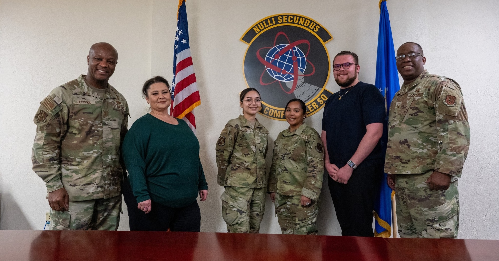 Group photo of military men and women and civilians, 6 people