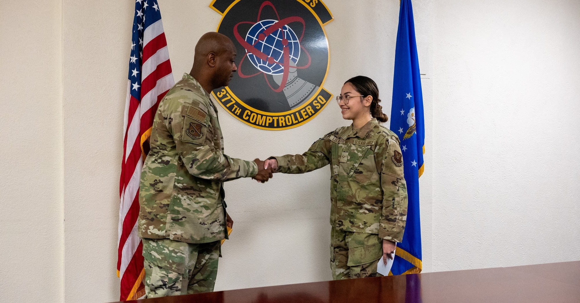 Military man coins military woman