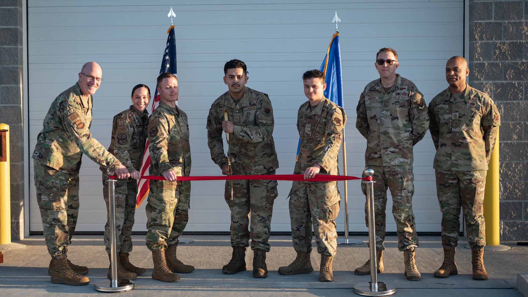 The 55th Logistics Readiness Squadron held a ribbon cutting ceremony for their new campus on March 14, 2025. Left to right: Col. Mark Howard, 55th Wing commander; Lt. Col. Caitlin Oviatt, 55th LRS commander, Senior Airman Nicholas Yankoski, Airman 1st Class Jesus Ambriz-Duran, and Senior Airman Jordan Steeves, all assigned to the 55th LRS; Chief Master Sgt. Christopher Herbers, 55th LRS senior enlisted leader; and Chief Master Sgt. Andrew Small, 55th Wing command chief. (U.S. Air Force photo by Daniel Martinez)