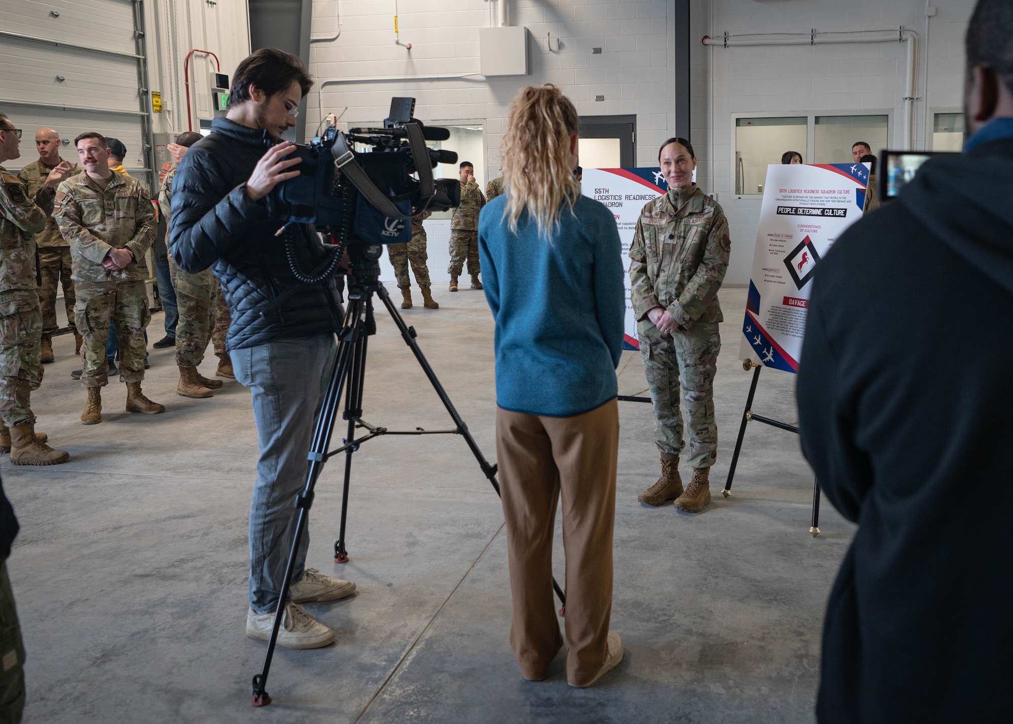 Lt. Col. Caitlin Oviatt, 55th Logistics Readiness Squadron commander, provides an interview for local media after a ribbon cutting ceremony for the new LRS campus March 14, 2025. More than 50 Airmen, civilians, and leaders attended the event. (U.S. Air Force photo by Daniel Martinez)