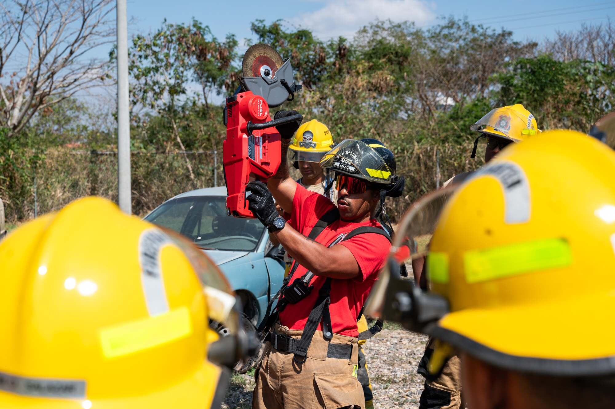 U.S. Air Force Senior Airman Janiel Elliot, Joint Task Force-Bravo firefighter, trains local Honduran firefighters on vehicle extrication at Soto Cano Air Base, Honduras, March 13, 2025.