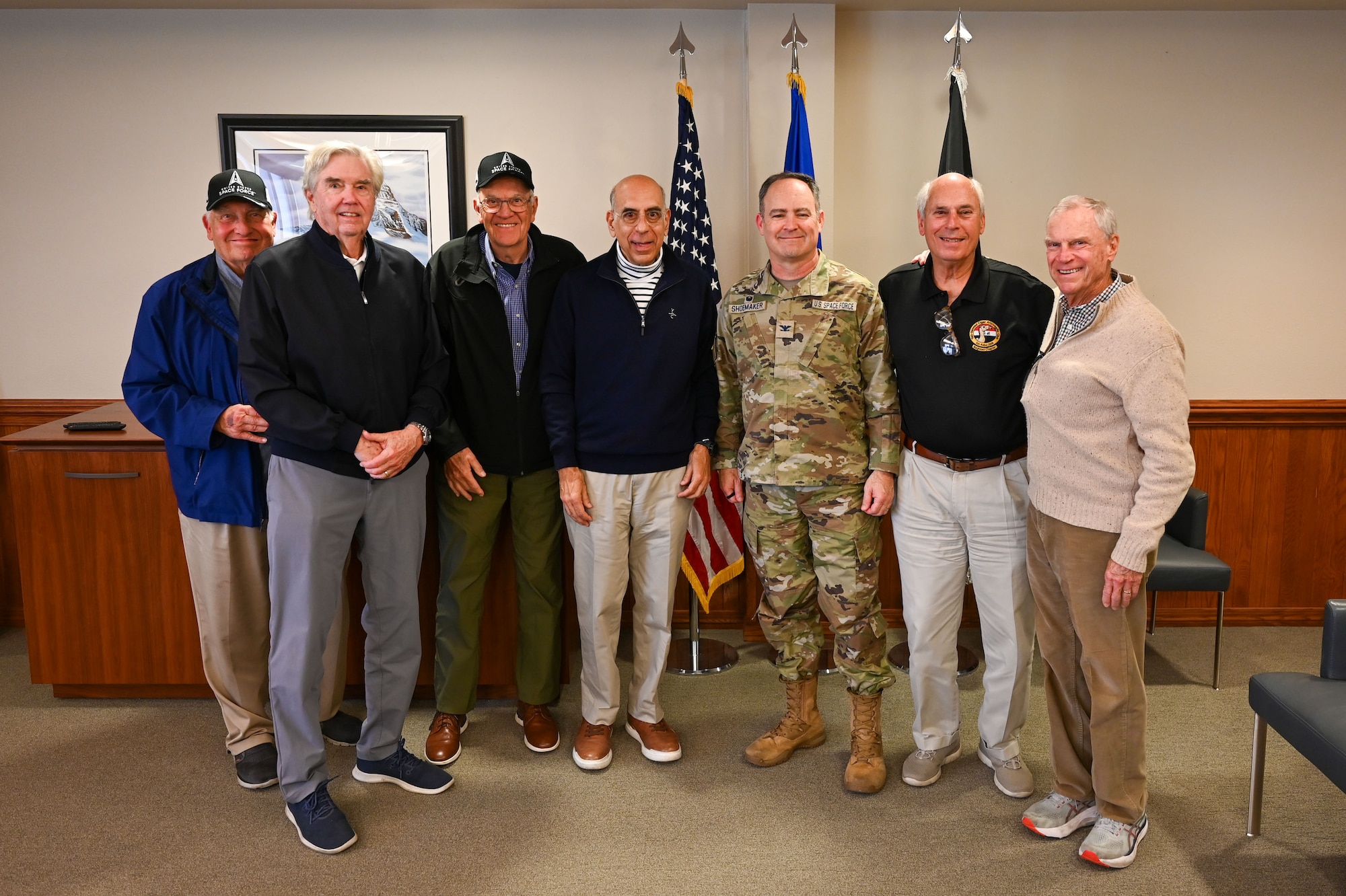 A group of people pose for a photo.