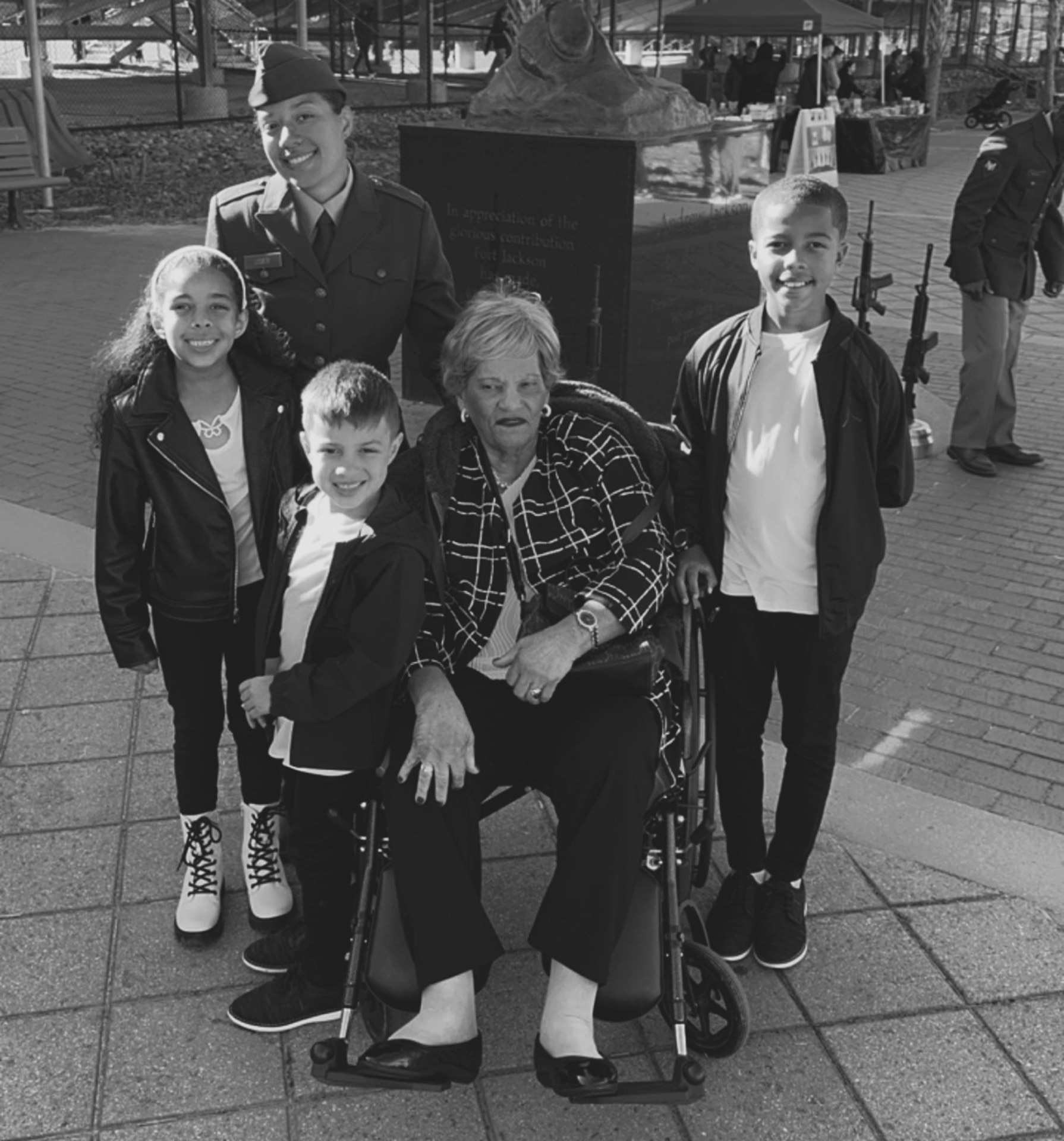 Pfc Lisier poses with her children and mother