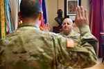 The District of Columbia National Guard’s Maj. Gen. John C. Andonie, Commanding General (Interim), swore in U.S. Army Master Sergeant Armando Leon as Assistant Inspector General during a ceremony on March 9, following his completion of the U.S. Army Inspector General School. Leon is the first Non-Commissioned Officer (NCO) to join the office, reflecting recent force structure reforms and a renewed command focus on readiness and care for Soldiers and Airmen. (U.S. Air National Guard photo by Master Sgt. Arthur M. Wright)