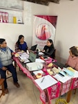 (L to R) Luz Ramirez, Quispicanchi project manager; Malu Mamani, Quispicanchi project regional advisor; Diana Olivares-Salazar, Quispicanchi project intern and New York MEPS medical technician; and Carmela Vise, process design consultant meet about expanding health programs in the Quispicanchi province of Peru. Olivares-Salazar, a medical technician at New York MEPS, recently traveled to Peru as part of her Master of Public Health program working with a nonprofit organization focused on sustainable health solutions in less fortunate communities.