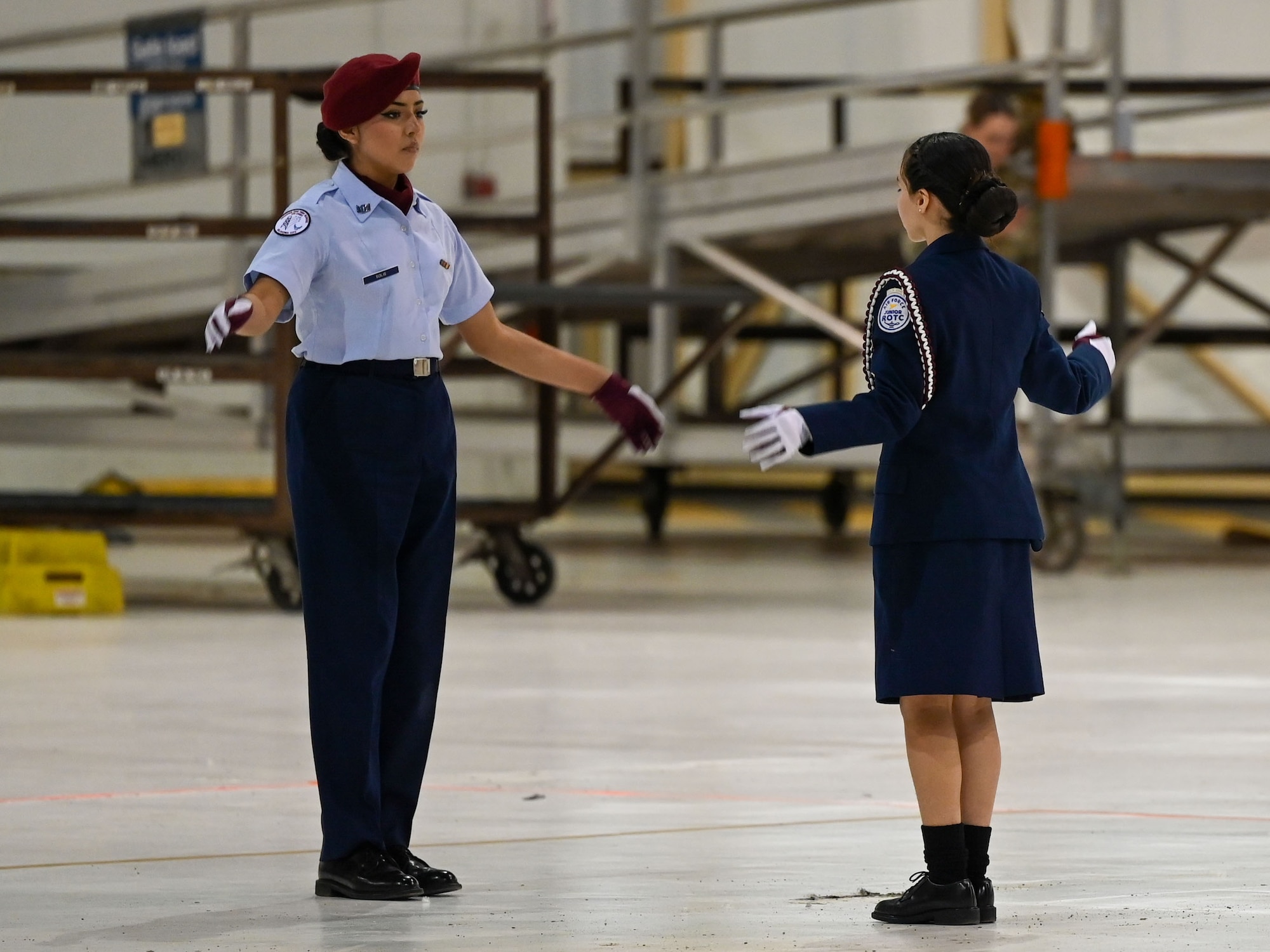 Junior Reserve Officers' Training Corps (JROTC) cadets perform a regulation drill sequence during the JROTC Drill Competition at Tinker Air Force Base, Oklahoma, Feb. 15, 2024. The event, returning to base after more than 20 years, featured precision marching, color guard performances, and exhibition routines. (U.S. Air Force photo by Garrett N. Cole)