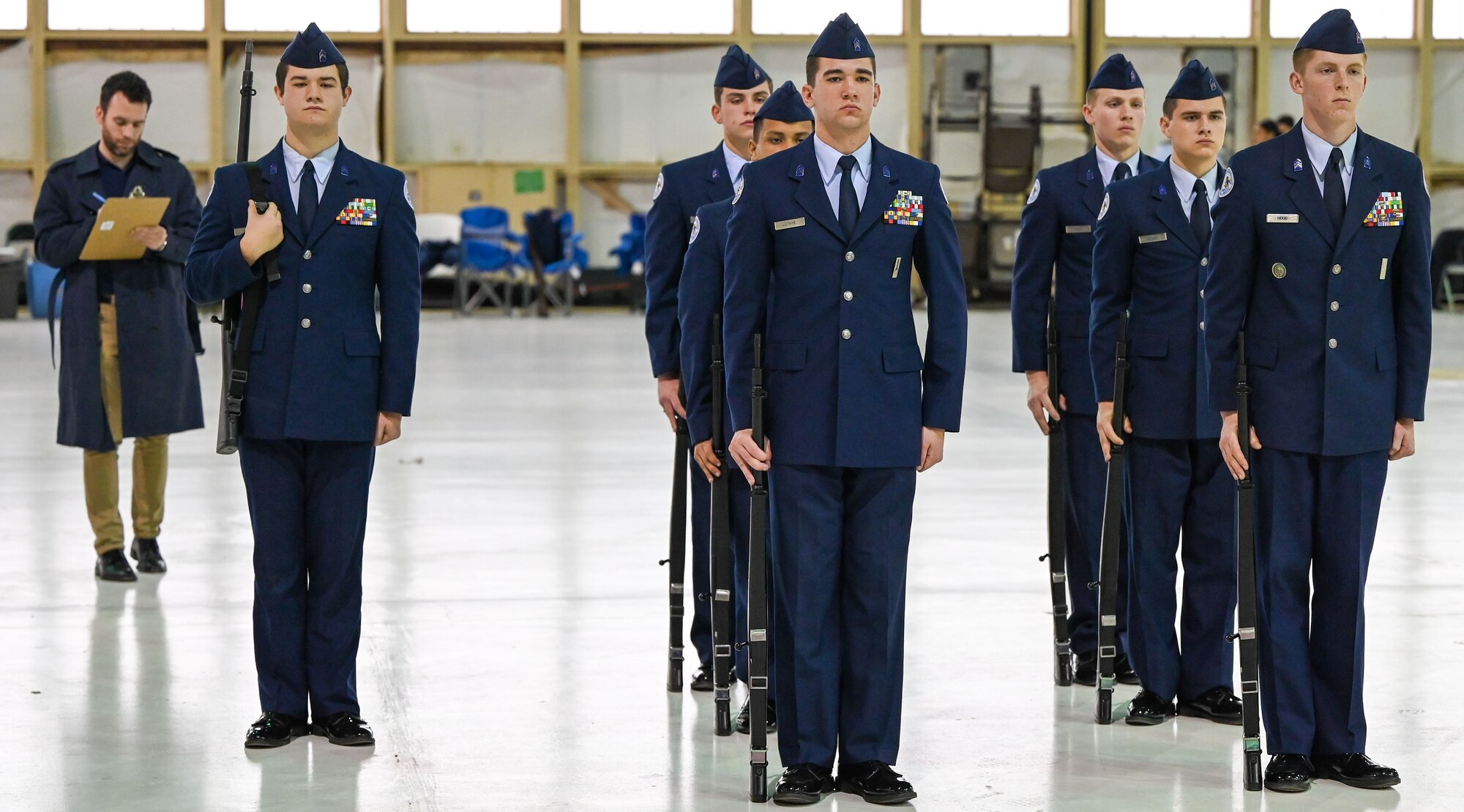 Junior Reserve Officers' Training Corps (JROTC) cadets stand in formation during an armed drill evaluation at the JROTC Drill Competition at Tinker Air Force Base, Oklahoma, Feb. 15, 2024. The event, returning to base for the first time in more than 20 years, showcased cadets' precision, discipline, and teamwork through regulation drills, color guard performances, and exhibition routines. (U.S. Air Force photo by Garrett N. Cole)