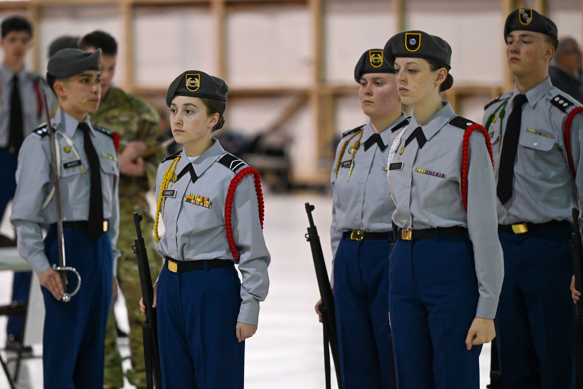 Junior Reserve Officers' Training Corps (JROTC) cadets stand in formation during an armed drill event at the JROTC Drill Competition at Tinker Air Force Base, Oklahoma, Feb. 15, 2024. The competition, making its return to the base after more than 20 years, featured precision drill sequences, color guard performances, and exhibition routines. (U.S. Air Force photo by Garrett N. Cole)