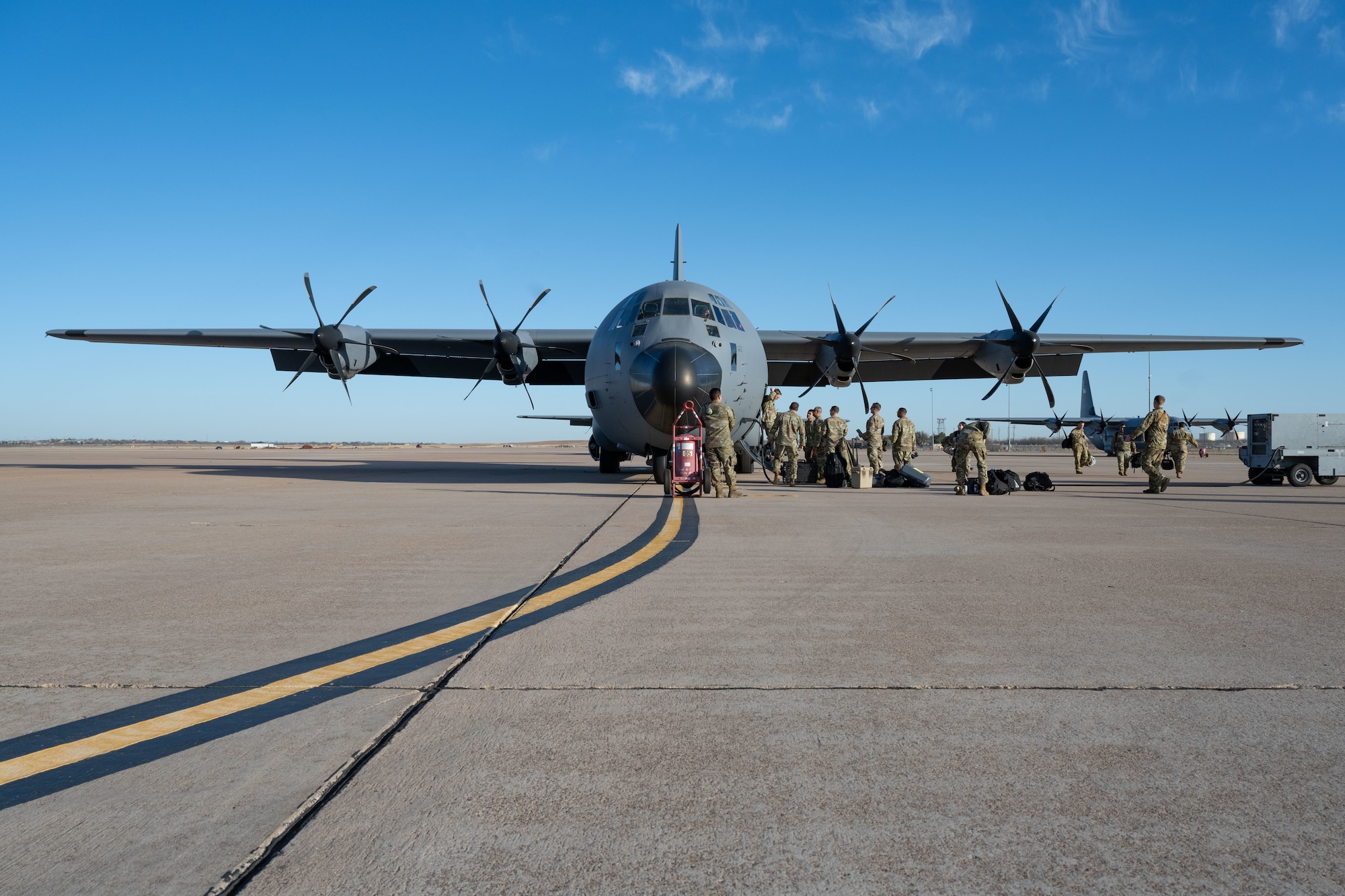Airmen assigned to the 317th Airlift Wing board a C-130J Super Hercules at Dyess Air Force Base, Texas, Feb. 25, 2025, before departing for a deployment to the U.S. Central Command area of responsibility. The 317th AW provides tactical airlift capabilities including airdrop and aeromedical evacuation, utilizing the C-130J’s versatility and advanced capabilities. (U.S. Air Force photo by Senior Airman Emma Anderson)