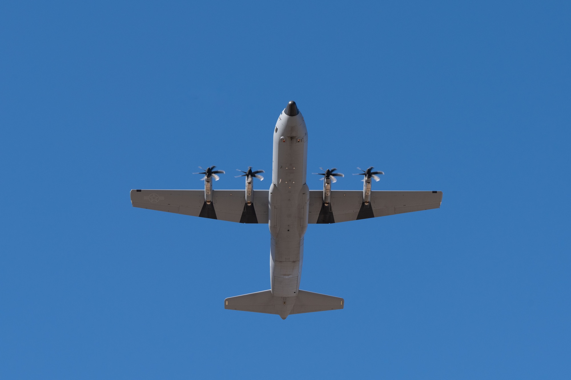 A C-130J Super Hercules flies overhead after departing for a deployment at Dyess Air Force Base, Texas, Feb. 25, 2025. The 317th AW meticulously plans and executes deployment taskings, demonstrating their commitment to global airlift. (U.S. Air Force photo by Senior Airman Emma Anderson)